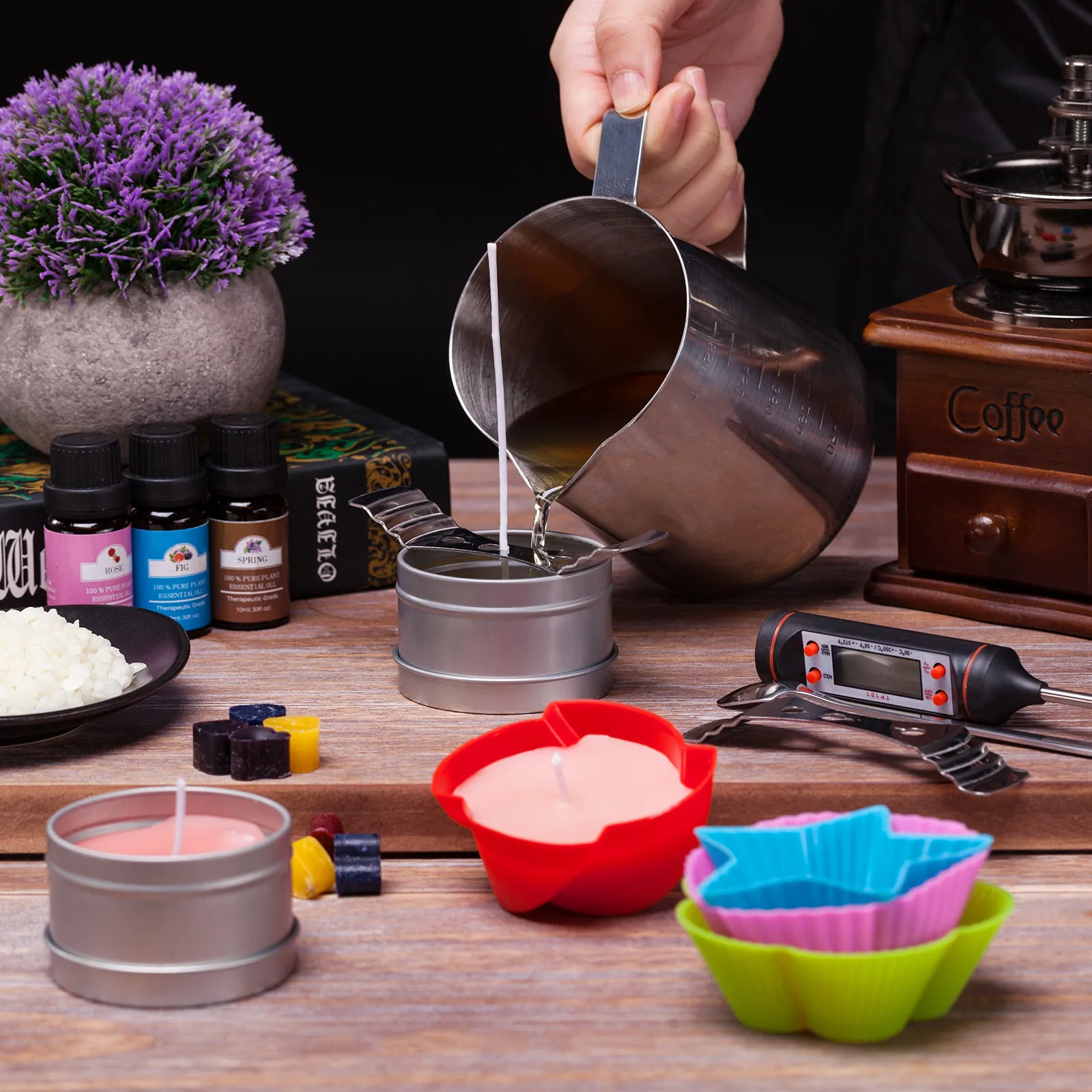Pouring melted soy wax during a handmade candle session
