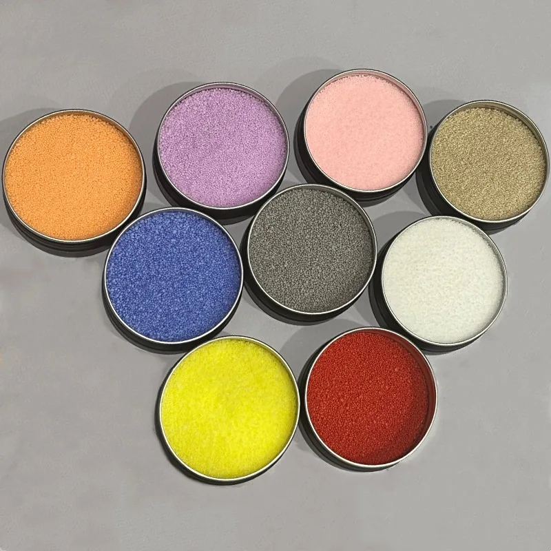 Sample tins showing the sand-wax colour range